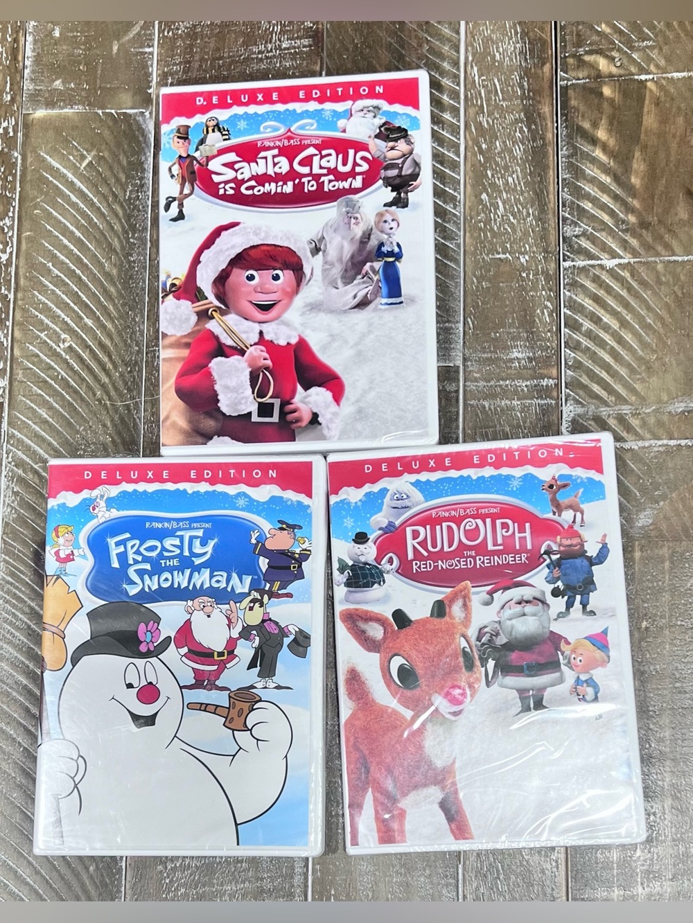 NEW- Deluxe Edition Rudolph, Frosty & Santa Claus Kids DVD Bundle - Red/White